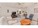 Comfortable living room with seating area and wood accents at 10881 Sw 79Th Ter, Ocala, FL 34476