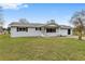 Ranch-style home with a carport and well-maintained lawn at 10881 Sw 79Th Ter, Ocala, FL 34476