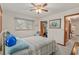 Comfortable bedroom with a queen-size bed and access to a large closet at 10881 Sw 79Th Ter, Ocala, FL 34476