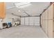 Two-car garage with built-in shelving and overhead storage at 10881 Sw 79Th Ter, Ocala, FL 34476
