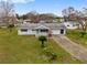 Single story home with driveway and landscaping at 10881 Sw 79Th Ter, Ocala, FL 34476
