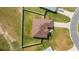Aerial view of a house with brown roof and fenced backyard at 3235 Se 43Rd Ave, Ocala, FL 34480