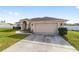 One-story house with attached garage and landscaped lawn at 3235 Se 43Rd Ave, Ocala, FL 34480