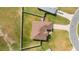 Aerial view of a house with brown roof and fenced backyard at 3235 Se 43Rd Ave, Ocala, FL 34480