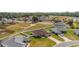 Aerial view of three houses on a residential street at 3235 Se 43Rd Ave, Ocala, FL 34480