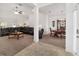 Open living area with a large sectional sofa and access to dining area at 3235 Se 43Rd Ave, Ocala, FL 34480