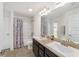 Bathroom with double vanity, tub, and shower at 3235 Se 43Rd Ave, Ocala, FL 34480