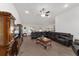 Spacious living room featuring a large sectional sofa and flat-screen TV at 3235 Se 43Rd Ave, Ocala, FL 34480