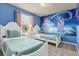 bedroom with twin beds, a whimsical mural, and soft colors at 3004 Mahalo Dr, Davenport, FL 33897