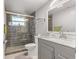 Modern bathroom with a walk-in shower and vanity at 11782 Sw 140Th St, Dunnellon, FL 34432