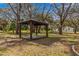 Wooden gazebo in a large backyard at 11782 Sw 140Th St, Dunnellon, FL 34432