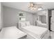 Bedroom with a full bed, built-in shelving, and mirrored closet at 11782 Sw 140Th St, Dunnellon, FL 34432