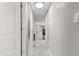 Bright hallway with gray walls and tile floors at 11782 Sw 140Th St, Dunnellon, FL 34432