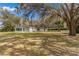 Side view of the house, showing shed and yard at 11782 Sw 140Th St, Dunnellon, FL 34432