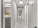 Clean hallway with tile floor and access to bathroom and bedroom at 11782 Sw 140Th St, Dunnellon, FL 34432