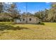 Rear view of the house with shed and large yard at 11782 Sw 140Th St, Dunnellon, FL 34432