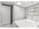 Bedroom with a full bed, window, and louvered doors at 11782 Sw 140Th St, Dunnellon, FL 34432
