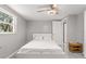 Spacious bedroom with ceiling fan and window offering natural light at 11782 Sw 140Th St, Dunnellon, FL 34432
