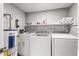 Laundry room with washer, dryer, and utility sink at 11782 Sw 140Th St, Dunnellon, FL 34432
