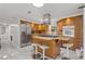 Open kitchen with stainless steel appliances and an island at 11782 Sw 140Th St, Dunnellon, FL 34432