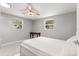Bright bedroom with a queen bed, desk, and large windows at 11782 Sw 140Th St, Dunnellon, FL 34432