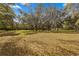 Large backyard with gazebo and mature trees at 11782 Sw 140Th St, Dunnellon, FL 34432