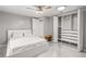 Bright bedroom featuring a modern bed frame and built-in closet at 11782 Sw 140Th St, Dunnellon, FL 34432