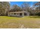 Ranch-style home with large yard and mature trees at 11782 Sw 140Th St, Dunnellon, FL 34432