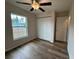 Spacious bedroom featuring a large closet and window at 233 Locust Ln, Ocala, FL 34472