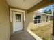 Front entry with decorative door and sidelights at 233 Locust Ln, Ocala, FL 34472