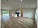 Open kitchen with stainless steel appliances and an island at 233 Locust Ln, Ocala, FL 34472