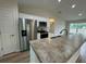 Modern kitchen with stainless steel appliances and granite countertops at 233 Locust Ln, Ocala, FL 34472