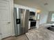 Kitchen with stainless steel appliances and white cabinets at 233 Locust Ln, Ocala, FL 34472