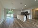 Open concept kitchen, stainless steel appliances, and breakfast bar at 233 Locust Ln, Ocala, FL 34472