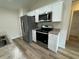 Kitchen with stainless steel appliances and granite countertops at 233 Locust Ln, Ocala, FL 34472