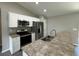 Modern kitchen with stainless steel appliances and granite countertops at 235 Locust Ln, Ocala, FL 34472