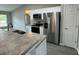 Stainless steel appliances and granite countertops in this kitchen at 235 Locust Ln, Ocala, FL 34472