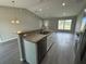 Modern kitchen with island and stainless steel dishwasher at 235 Locust Ln, Ocala, FL 34472
