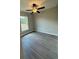 Bright bedroom with ceiling fan and vinyl flooring at 235 Locust Ln, Ocala, FL 34472