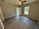 Bright bedroom with door leading to backyard at 235 Locust Ln, Ocala, FL 34472
