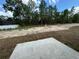 Empty lot with some vegetation and concrete slab at 235 Locust Ln, Ocala, FL 34472