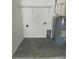 Garage laundry area with shelving at 235 Locust Ln, Ocala, FL 34472