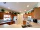 Bright kitchen with wood cabinets, ample counter space, and a breakfast bar at 15338 Sw 14Th Avenue Rd, Ocala, FL 34473