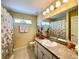 Bathroom with tub shower combination and updated vanity at 15338 Sw 14Th Avenue Rd, Ocala, FL 34473