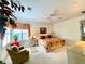 Large main bedroom with king-size bed, ceiling fan, and ample natural light at 15338 Sw 14Th Avenue Rd, Ocala, FL 34473