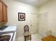 Laundry room with washer, dryer, and additional storage at 15338 Sw 14Th Avenue Rd, Ocala, FL 34473