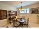 Bright dining room with a charming round table and four chairs, featuring a decorative wall shelf at 15338 Sw 14Th Avenue Rd, Ocala, FL 34473