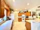 Spacious kitchen with light wood cabinets, ample counter space, and white appliances at 15338 Sw 14Th Avenue Rd, Ocala, FL 34473