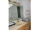 Bathroom with a sink, mirror and light wood vanity at 7946 Juniper Rd, Ocala, FL 34480