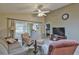Spacious living room with ample seating and large TV at 5247 Nw 18Th St, Ocala, FL 34482
